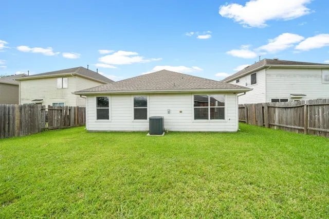 a backyard of a house with lots of green space