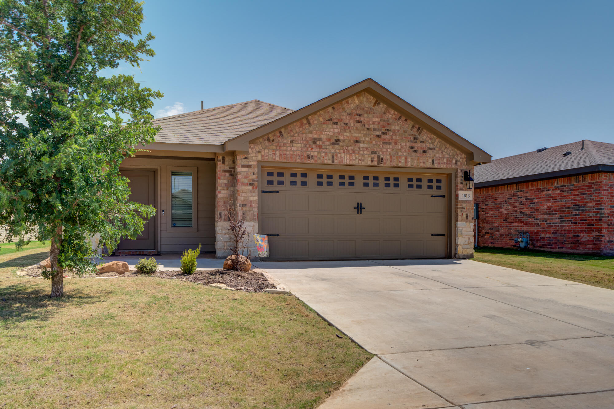 4613 126th Street Lubbock, TX 79424 - Photo 2 of 37 a view of yellow house with an outdoor space
