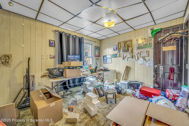 a work room with furniture and a window