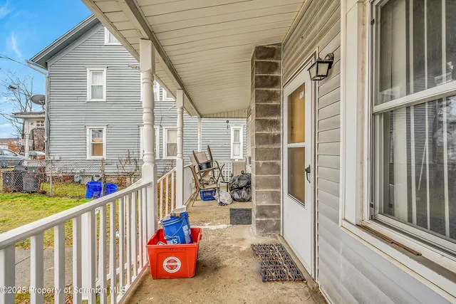 swimming pool view with a seating space