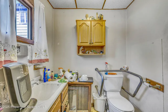 a bathroom with a toilet and a sink