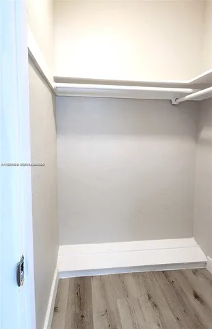 a view of street with parked cars