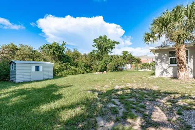 a view of a back yard of the house