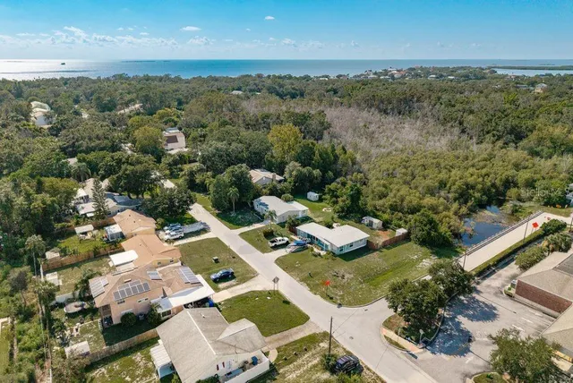 an aerial view of a house with a garden