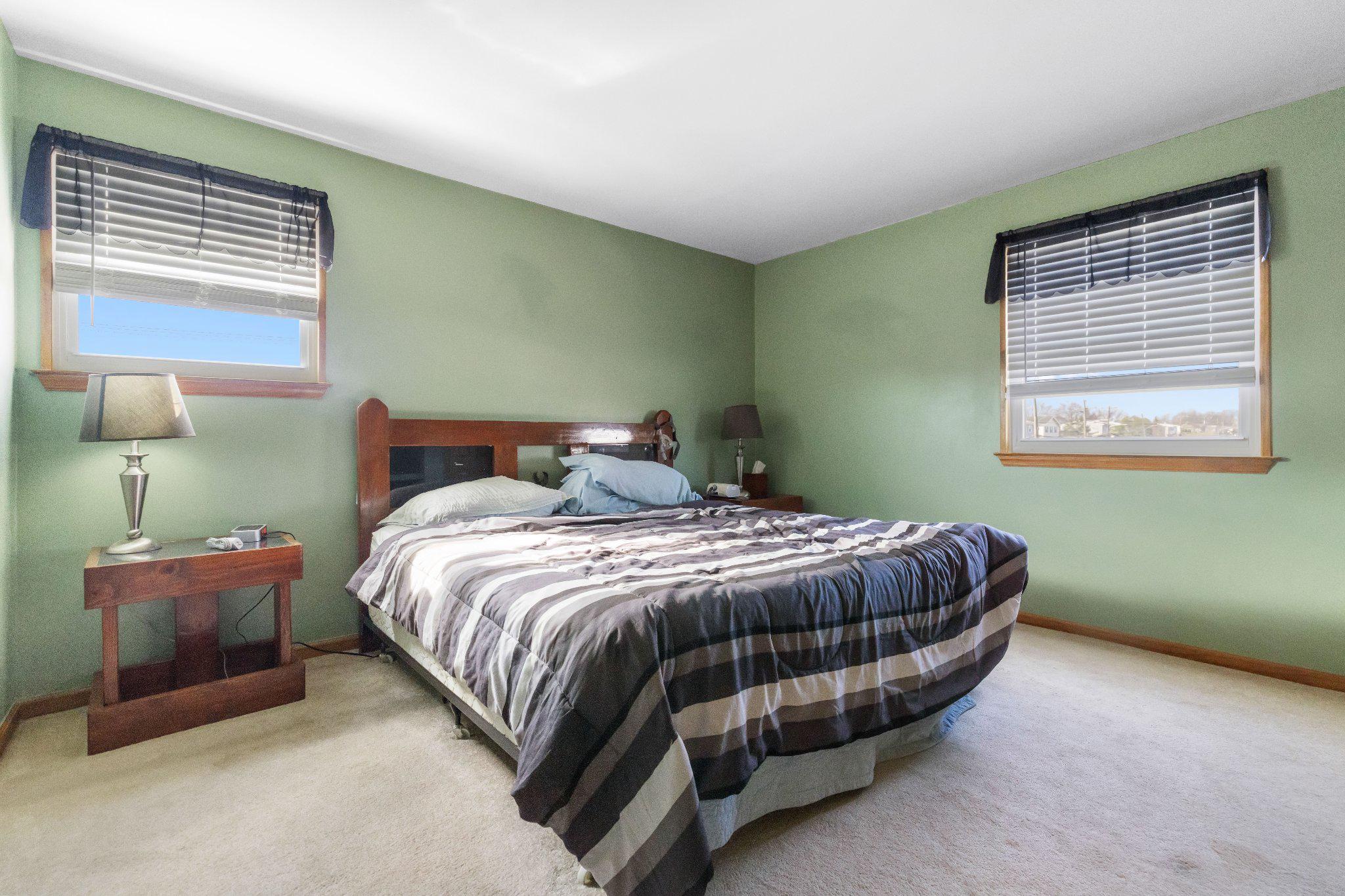 1842 Tomlinson Road Philadelphia, PA 19116 - Photo 13 of 31 a bed sitting in a bedroom next to a window