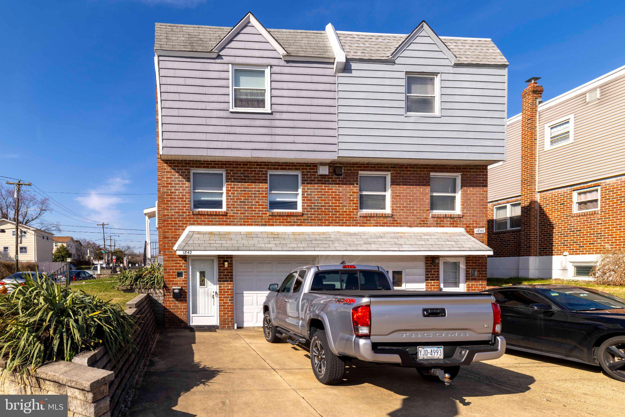 1842 Tomlinson Road Philadelphia, PA 19116 - Photo 2 of 31 a front view of a house with parking space