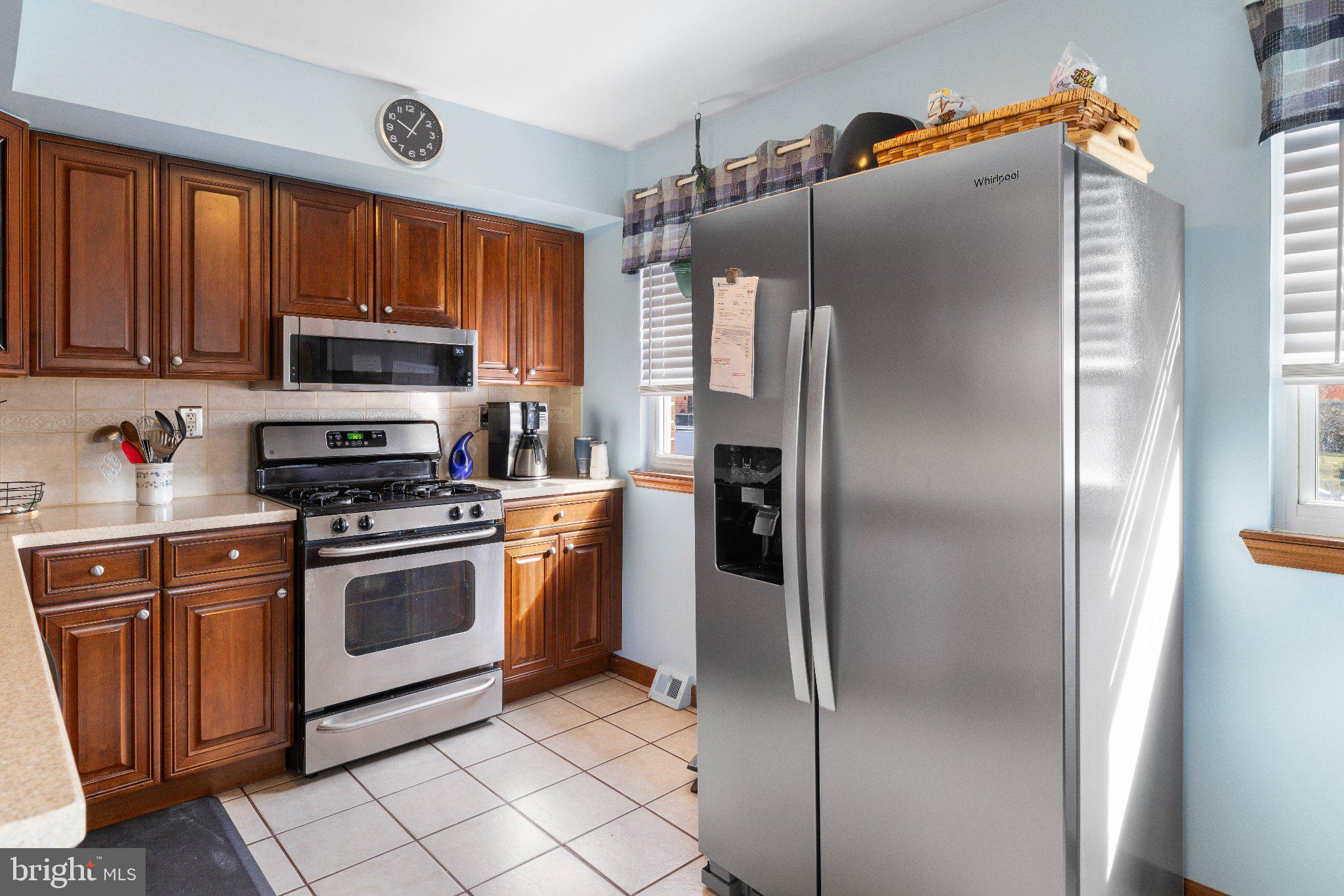 1842 Tomlinson Road Philadelphia, PA 19116 - Photo 10 of 31 a kitchen with stainless steel appliances granite countertop a refrigerator and a stove top oven