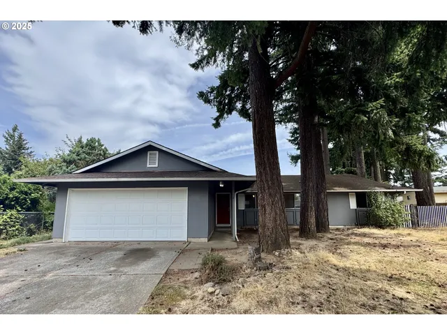 a house with trees in the background