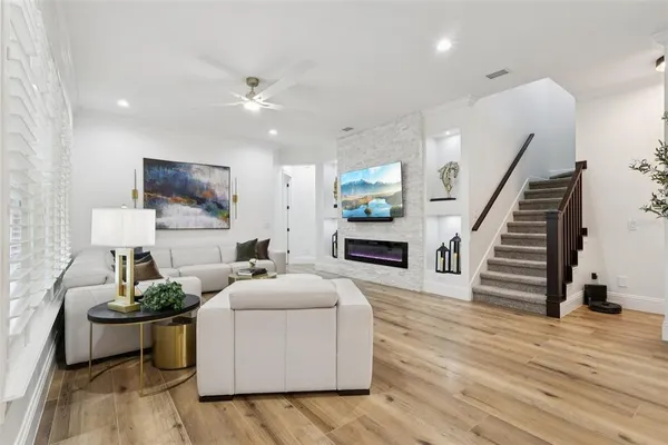a large white kitchen with stainless steel appliances