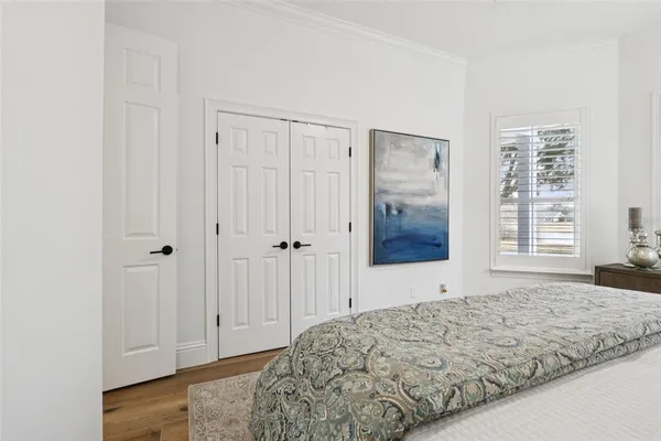 a living room with furniture and painting on the wall