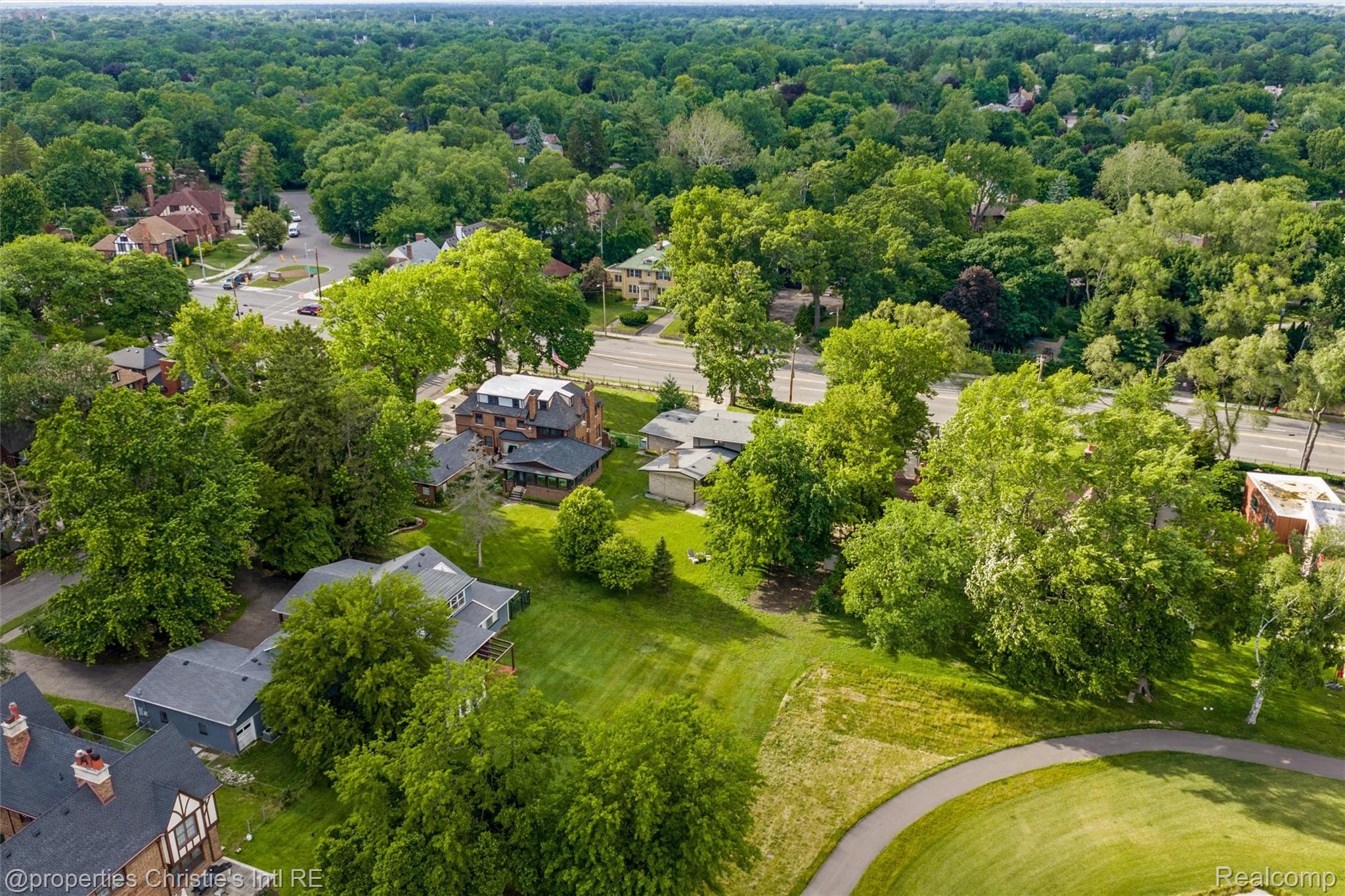 2771 West Seven Mile Road Detroit, MI 48221 - Photo 51 of 57 Aerial perspective showcasing the surrounding residential area and abundant mature trees
