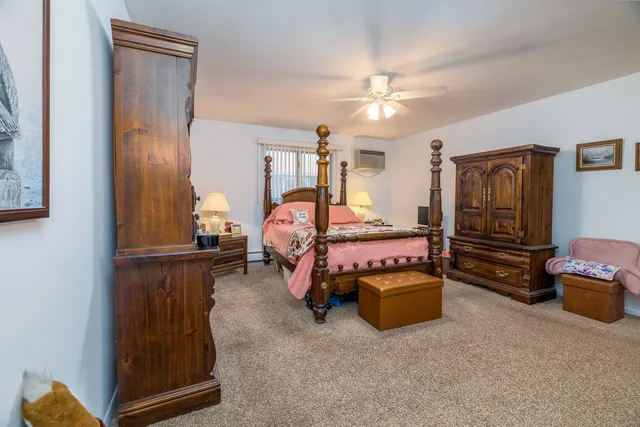 a bedroom with bed and window