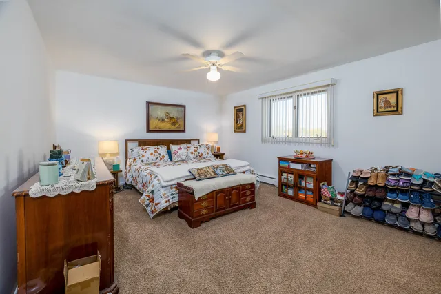 a bedroom with furniture and a bed