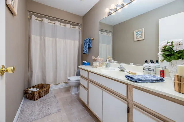 a bathroom with a sink double vanity and a mirror