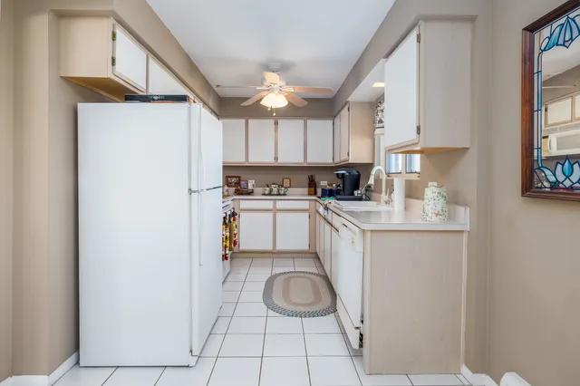 a kitchen with a sink cabinets and window