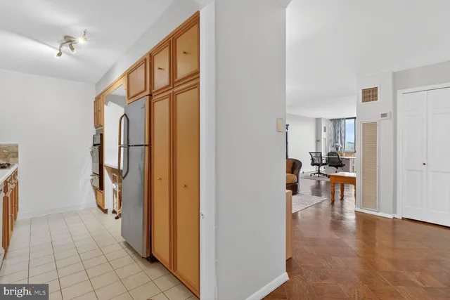 a view of a hallway view with living room and dining room