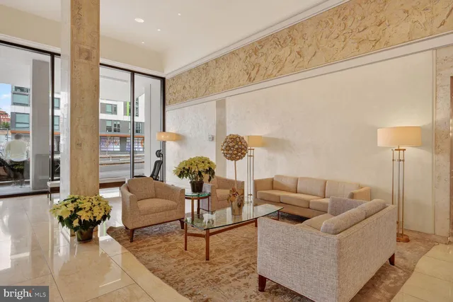 a living room with furniture and flowers