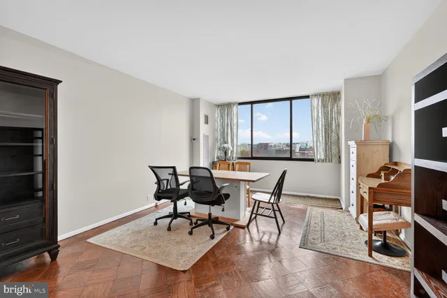 a workspace with furniture and a window