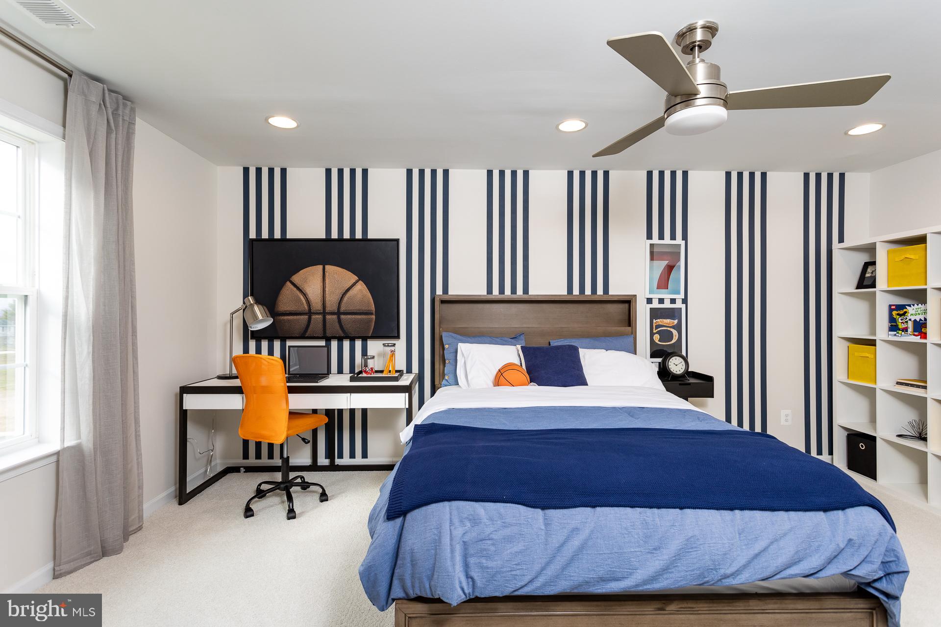 514 Benjamin Drive Hanover, PA 17331 - Photo 14 of 29 a bedroom with a bed a bookshelf and a window