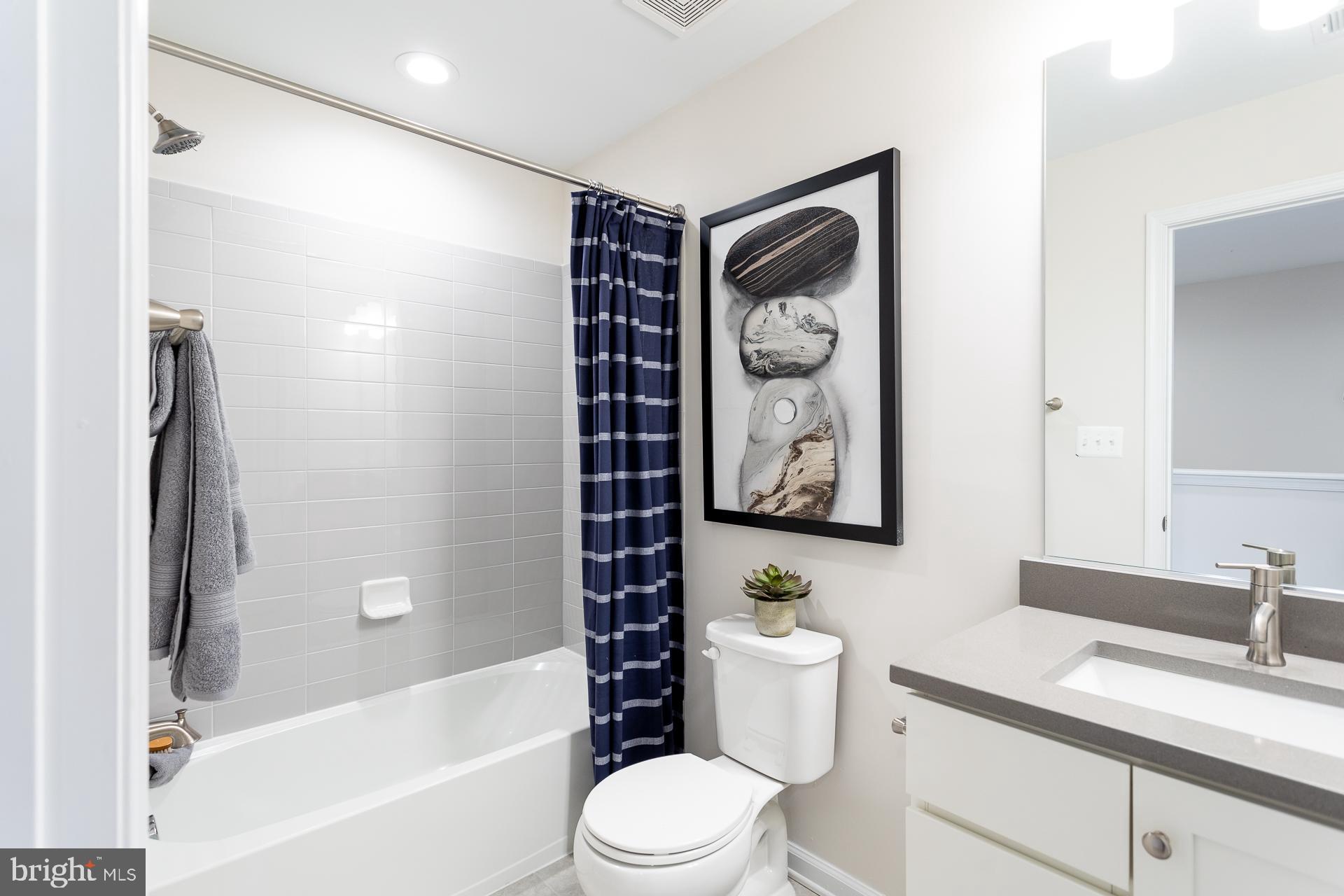 514 Benjamin Drive Hanover, PA 17331 - Photo 17 of 29 a bathroom with a toilet sink vanity tub and shower