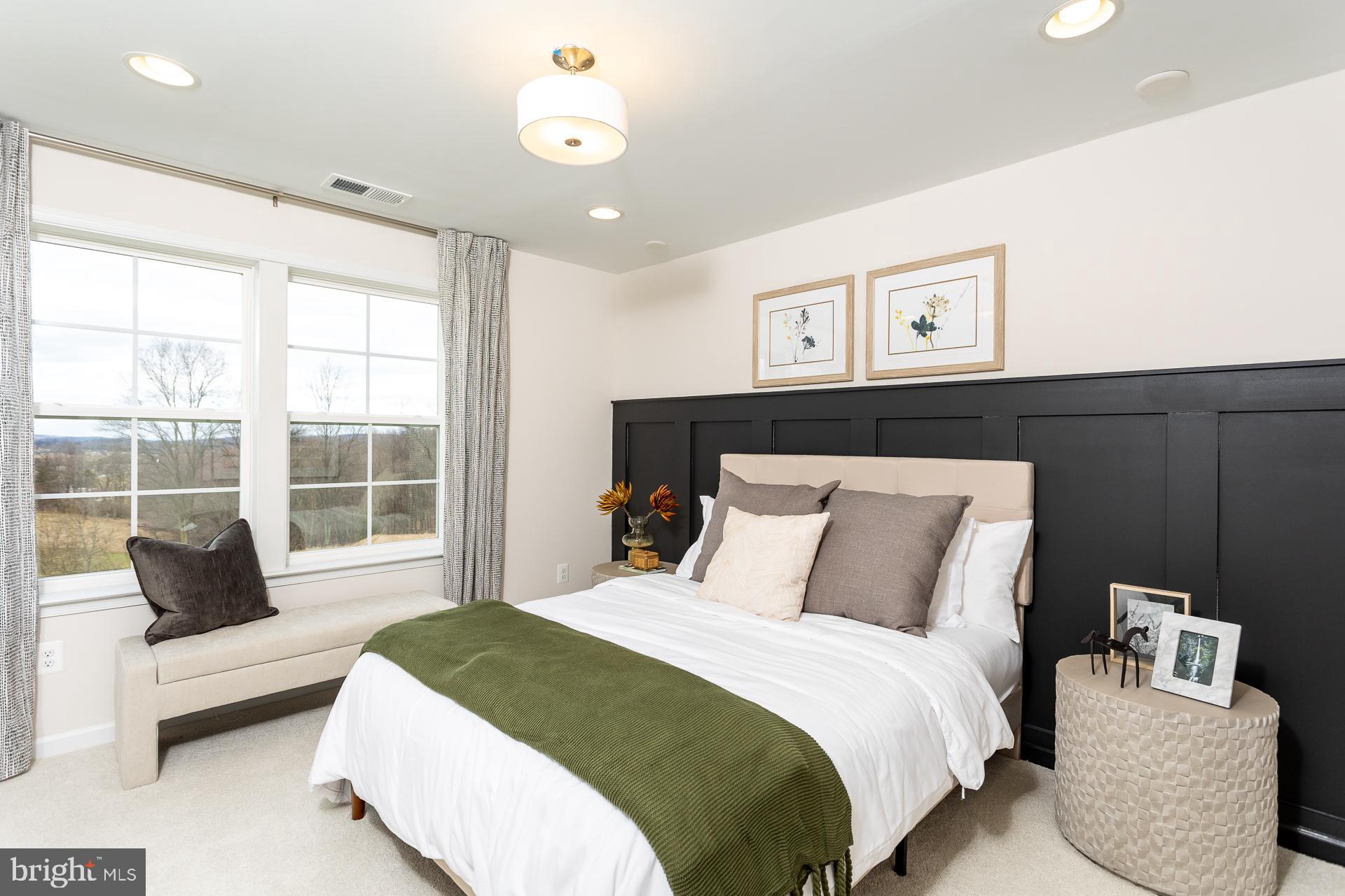 514 Benjamin Drive Hanover, PA 17331 - Photo 21 of 29 a bedroom with a large bed and a couch