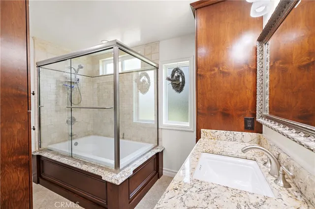 a bathroom with a tub and shower