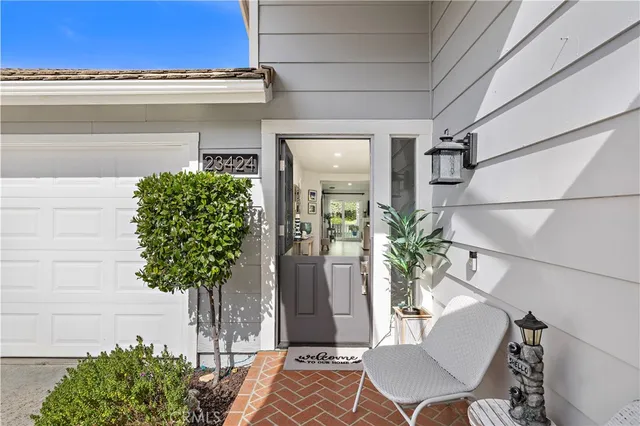 a vase of flowers sitting on a table with window