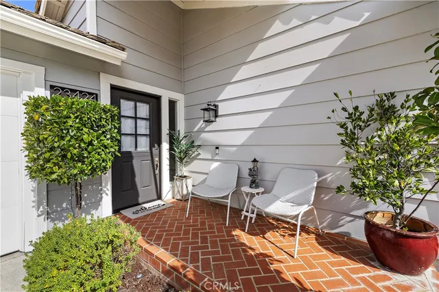 a couple of table and chair in a patio