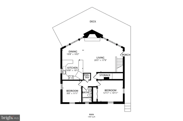 an empty room with windows and fireplace
