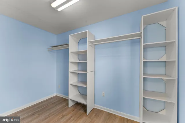 a view of a hallway with washer and dryer