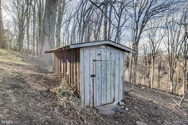 a view of a balcony with wooden floor and fence