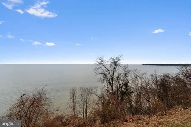 a view of a balcony with chair and wooden floor