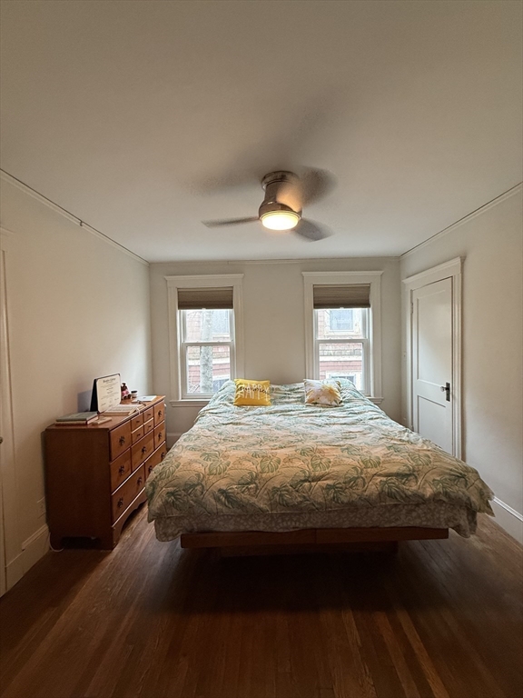 7 View S Avenue, Unit 3 Boston, MA 02130 - Photo 4 of 14 a bedroom with a bed and a chandelier