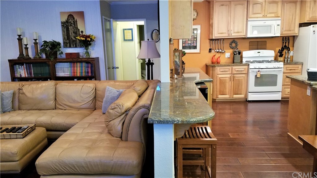 4731 Whipple Road Riverside, CA 92506 - Photo 11 of 66 The Centerpoint of the Great Room is a Granite, Pony/Half Wall which serves as a Dining Counter/Bar........only to be used IF Kids are allowed to eat in front of the TV(s)!!!