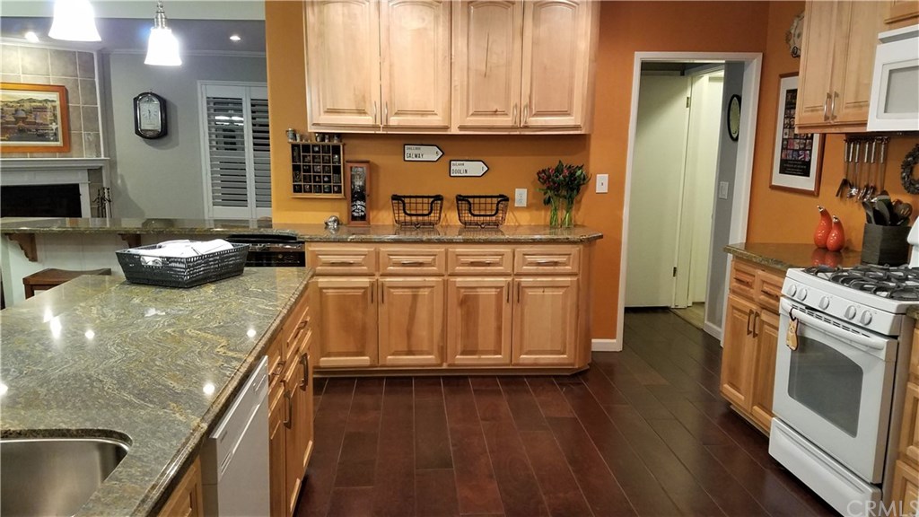 4731 Whipple Road Riverside, CA 92506 - Photo 15 of 66 KITCHEN (w/"Brown Wave" Granite. Note: Engineered Hardwood Floors - throughout The Kitchen, Dining Area AND GREAT ROOM!)