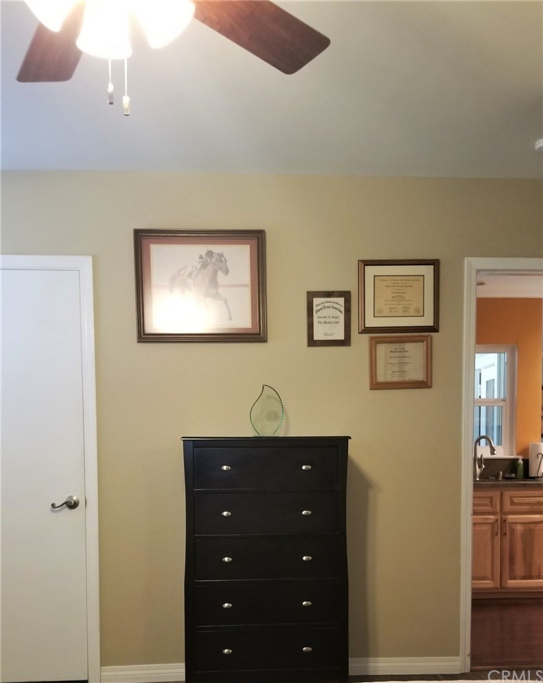 4731 Whipple Road Riverside, CA 92506 - Photo 18 of 66 PRIMARY BEDROOM. Door on Left to Primary Bathroom; Door on Right to Kitchen.