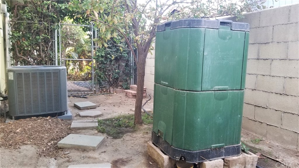 4731 Whipple Road Riverside, CA 92506 - Photo 64 of 66 TRANE AC, COMPOSTER (INCLUDED), PLUM TREE IN BACK SIDE YARD.