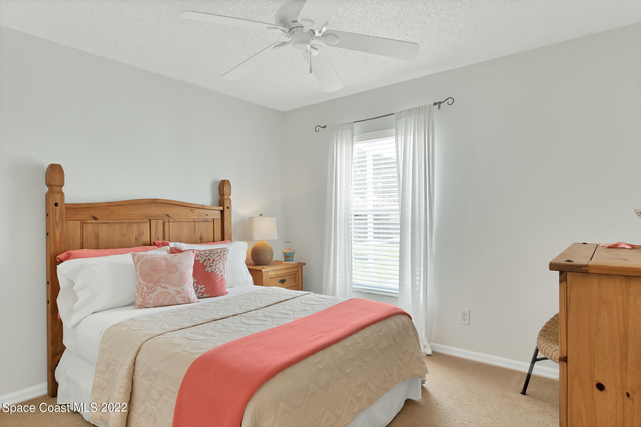 382 Benchor Street Sebastian, FL 32958 - Photo 12 of 34 a bedroom with a bed and a window
