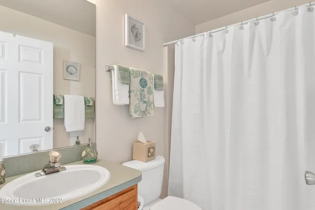 a room with a bed and a window