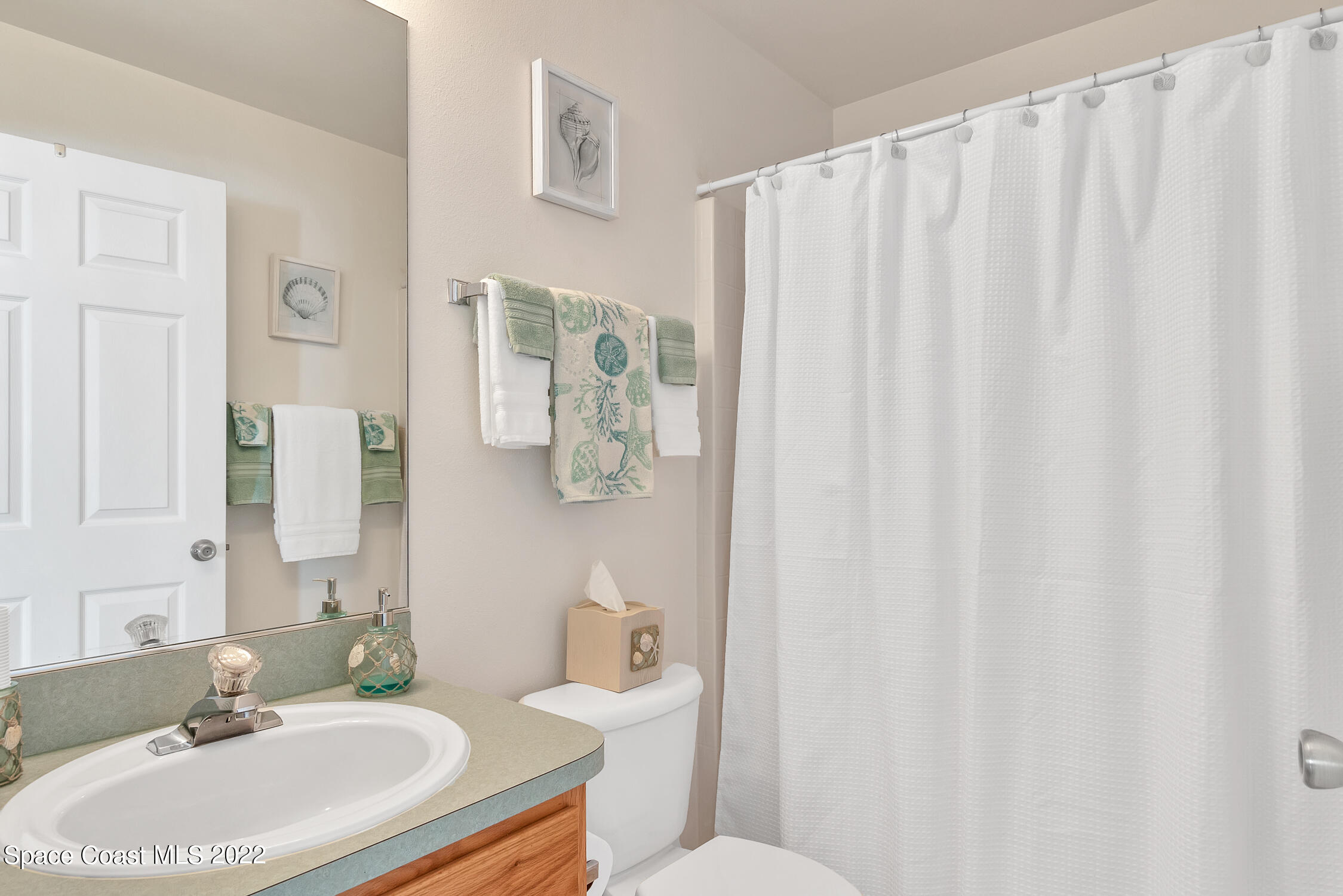 382 Benchor Street Sebastian, FL 32958 - Photo 14 of 34 a bathroom with a sink toilet and shower