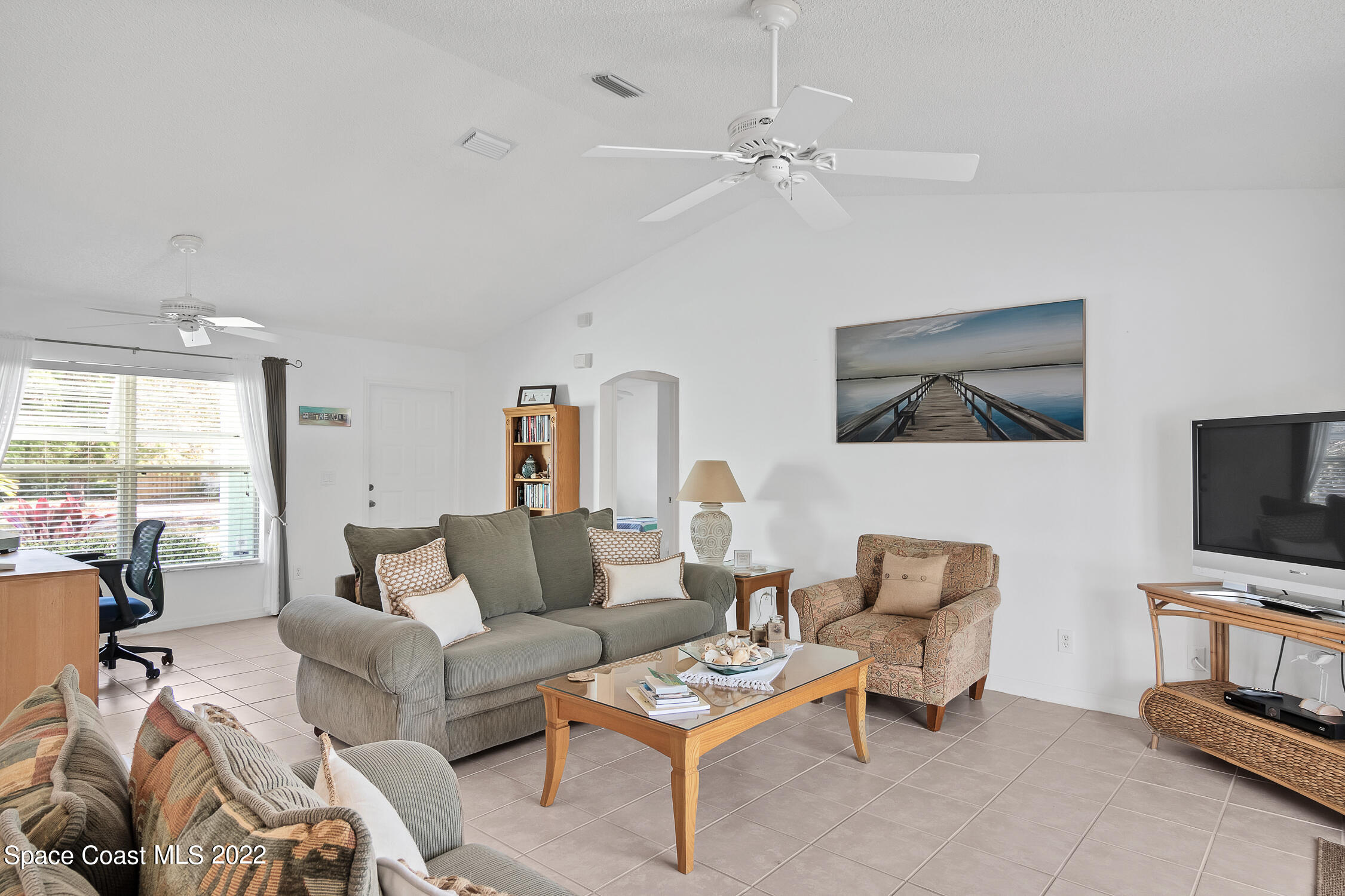 382 Benchor Street Sebastian, FL 32958 - Photo 18 of 34 a living room with furniture and a flat screen tv