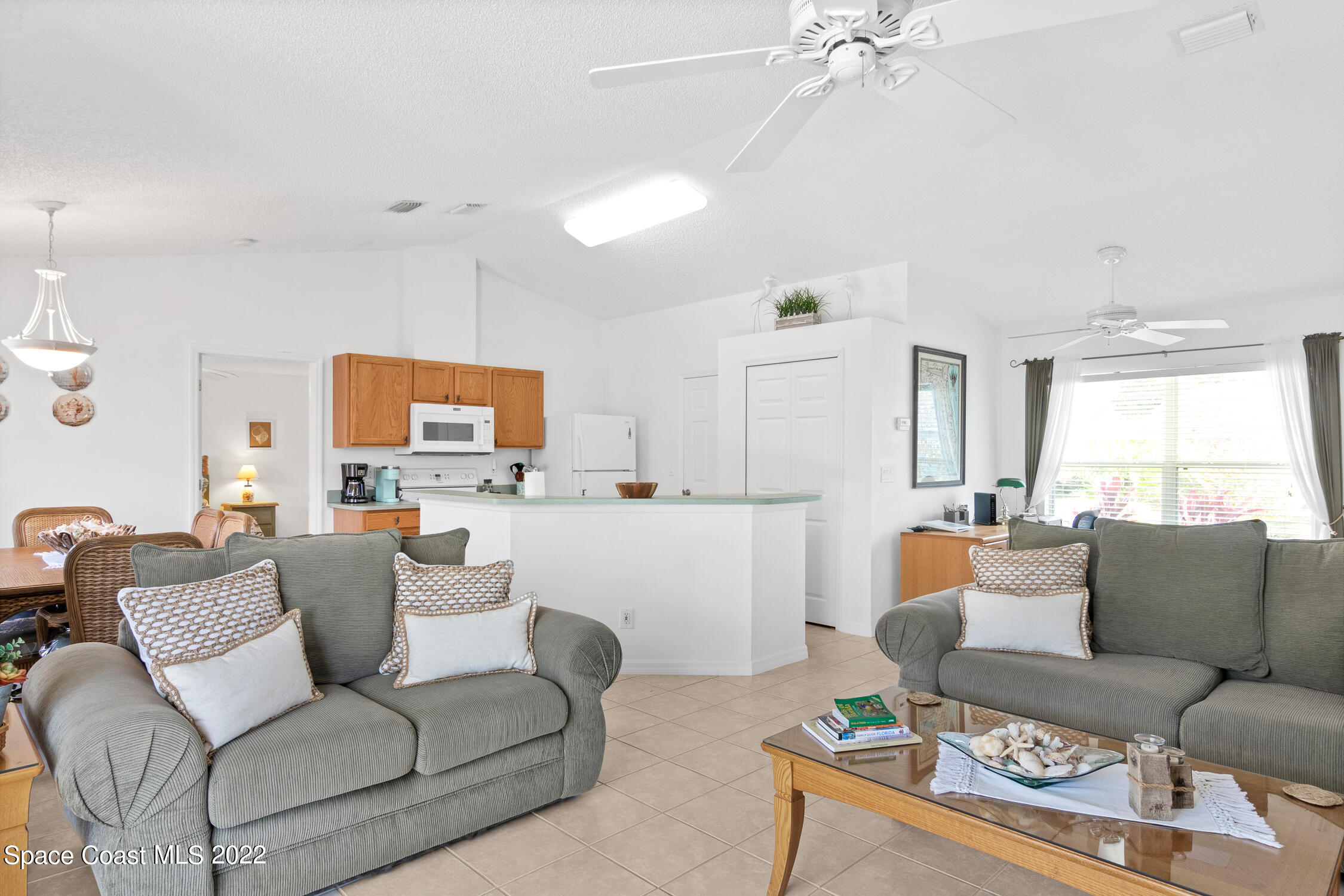 382 Benchor Street Sebastian, FL 32958 - Photo 19 of 34 a living room with furniture and a fireplace