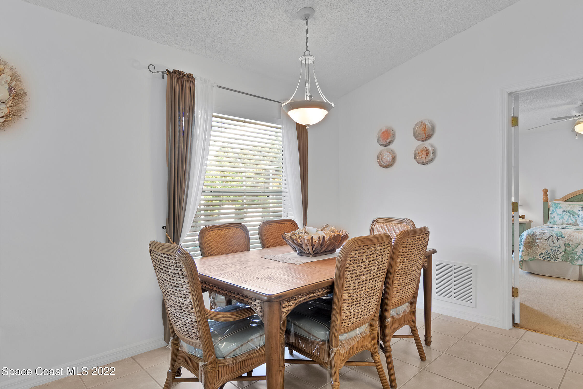 382 Benchor Street Sebastian, FL 32958 - Photo 24 of 34 a view of a dining room with furniture window and outside view
