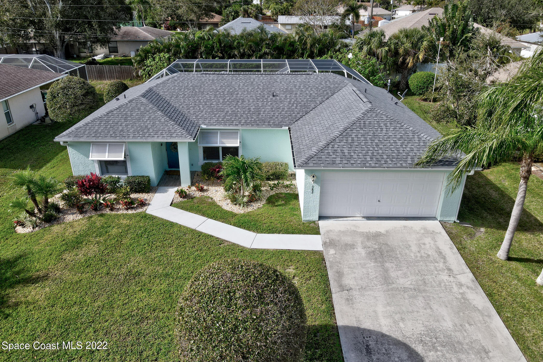 382 Benchor Street Sebastian, FL 32958 - Photo 29 of 34 a aerial view of a house with table and chairs under an umbrella