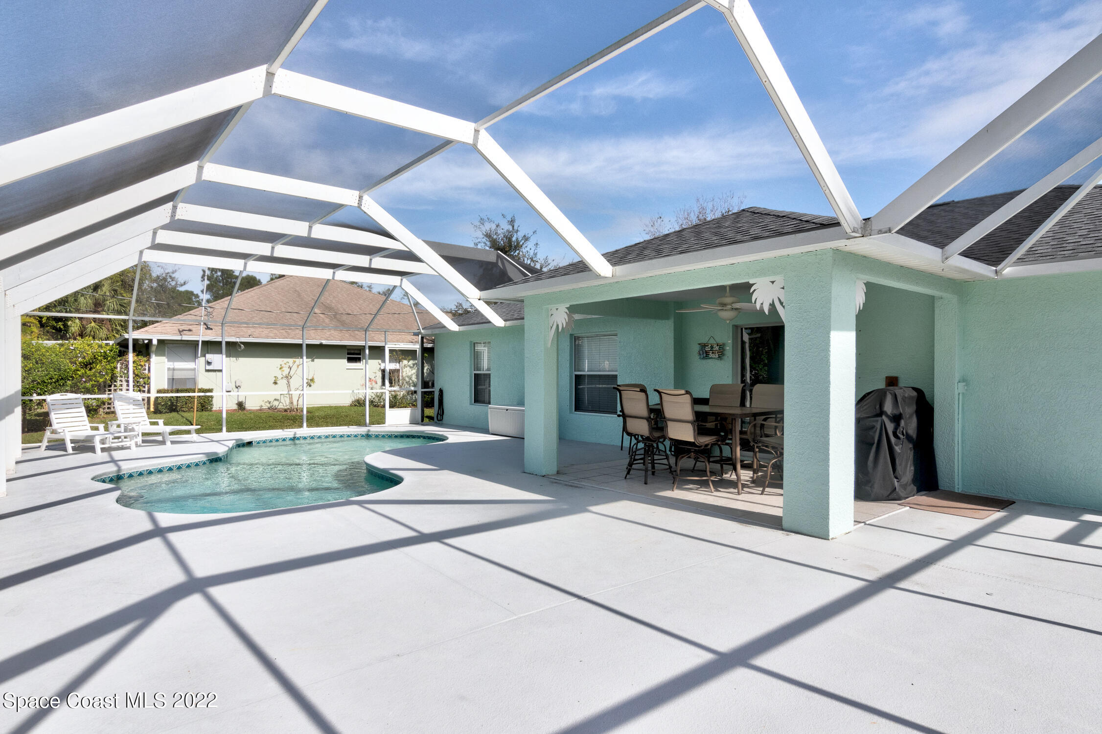 382 Benchor Street Sebastian, FL 32958 - Photo 6 of 34 a view of a porch with table and chairs