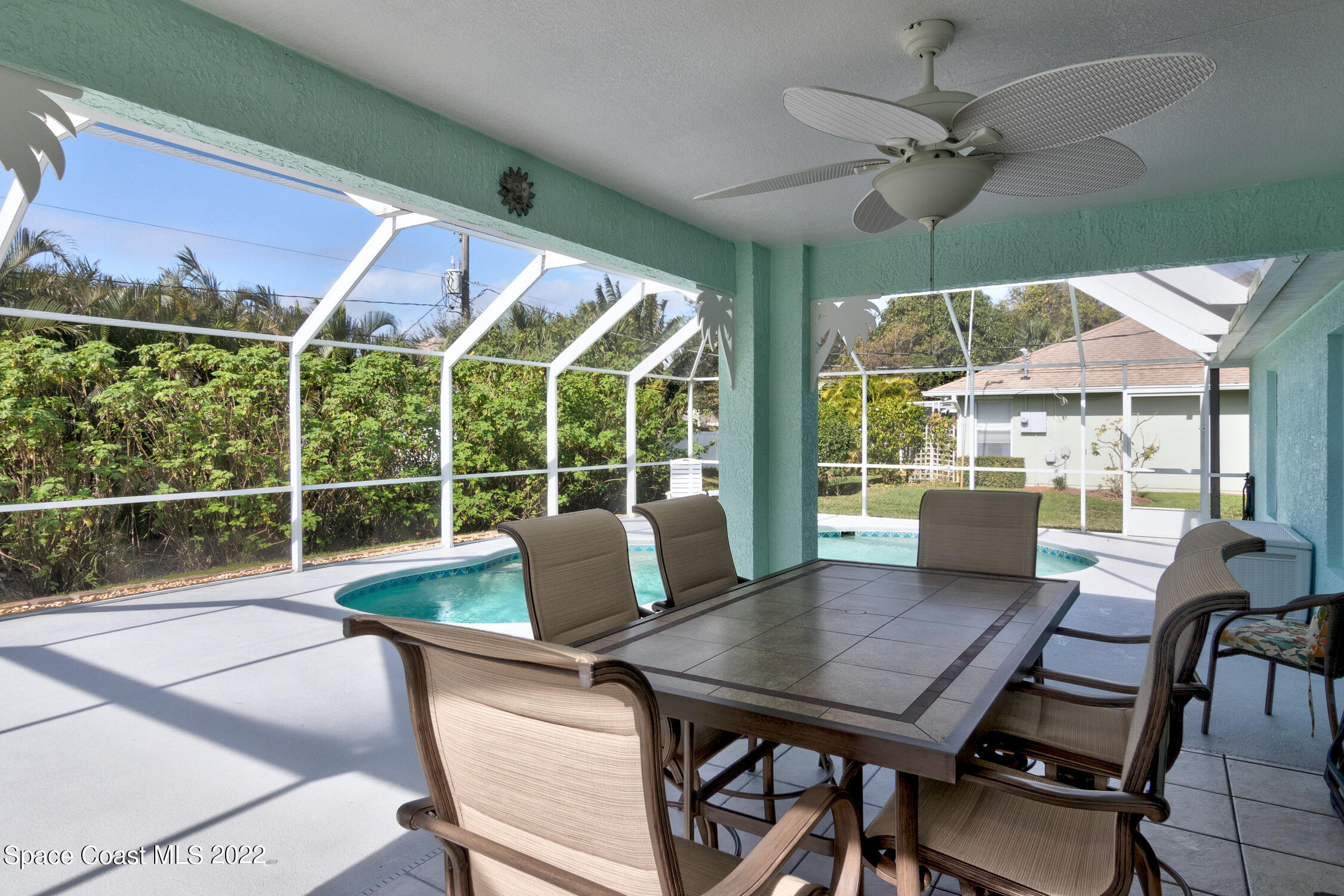 382 Benchor Street Sebastian, FL 32958 - Photo 7 of 34 a view of a patio with a dining table and chairs