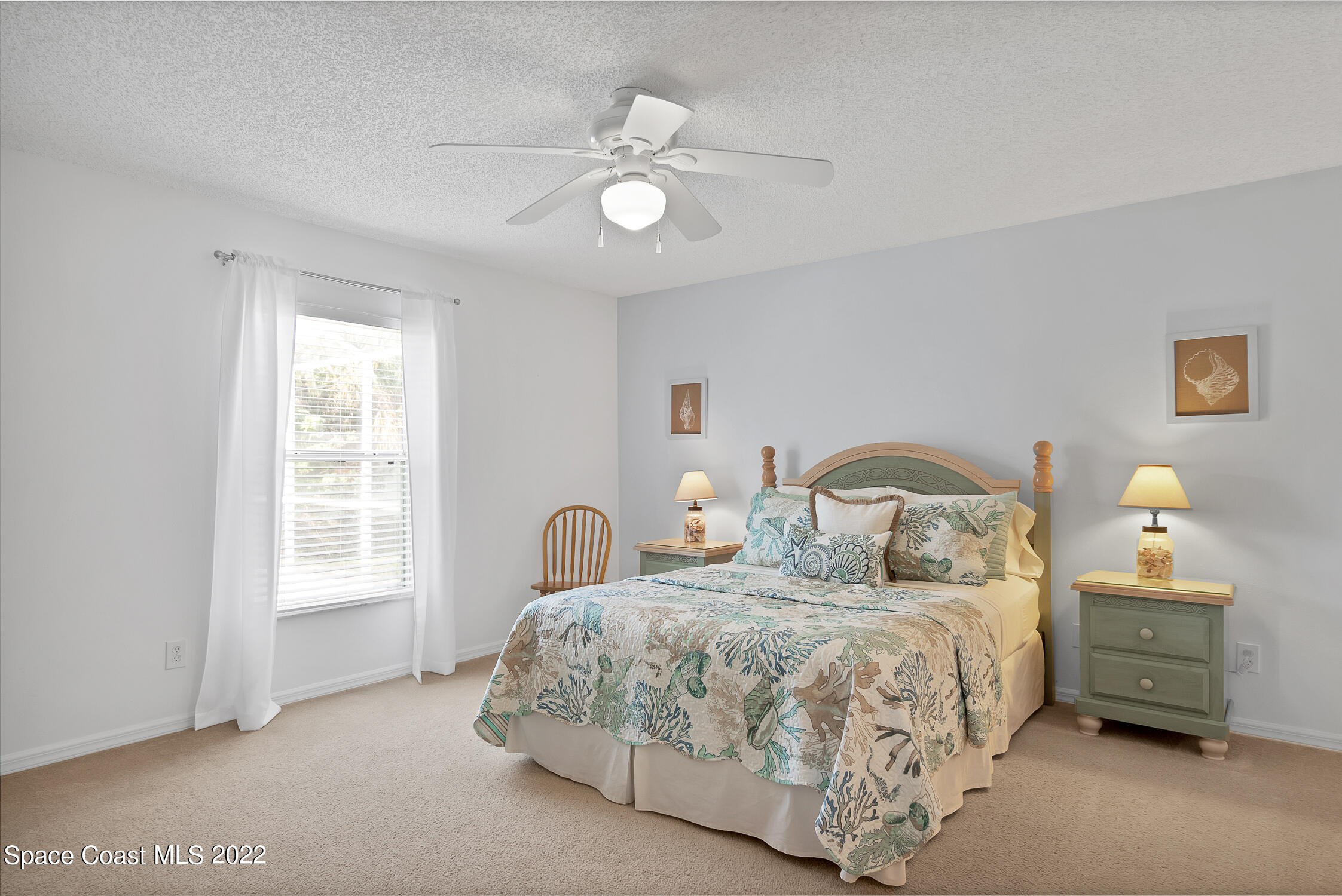 382 Benchor Street Sebastian, FL 32958 - Photo 9 of 34 a bedroom with a bed and a window