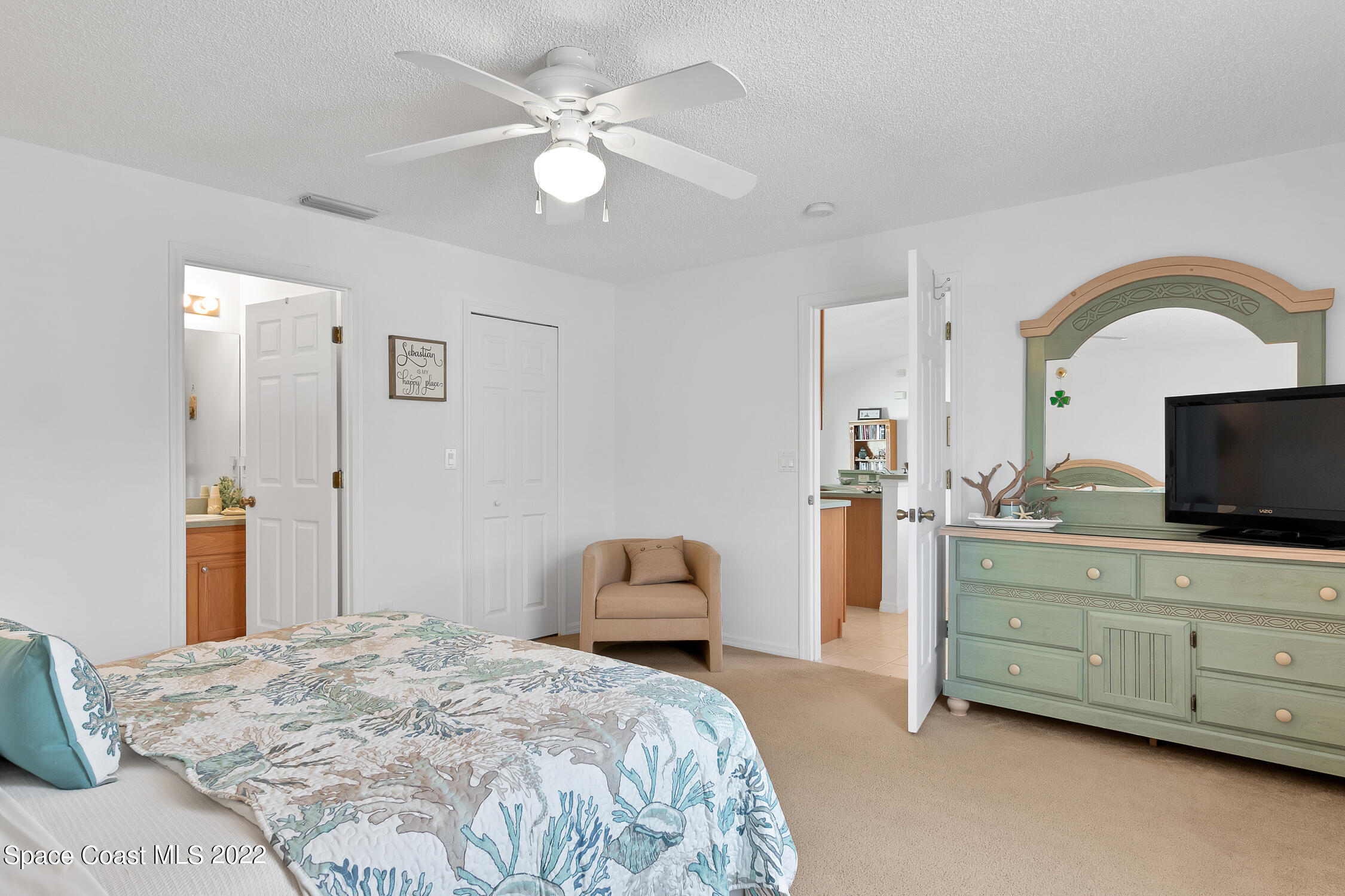 382 Benchor Street Sebastian, FL 32958 - Photo 10 of 34 a bedroom with a bed and a flat screen tv