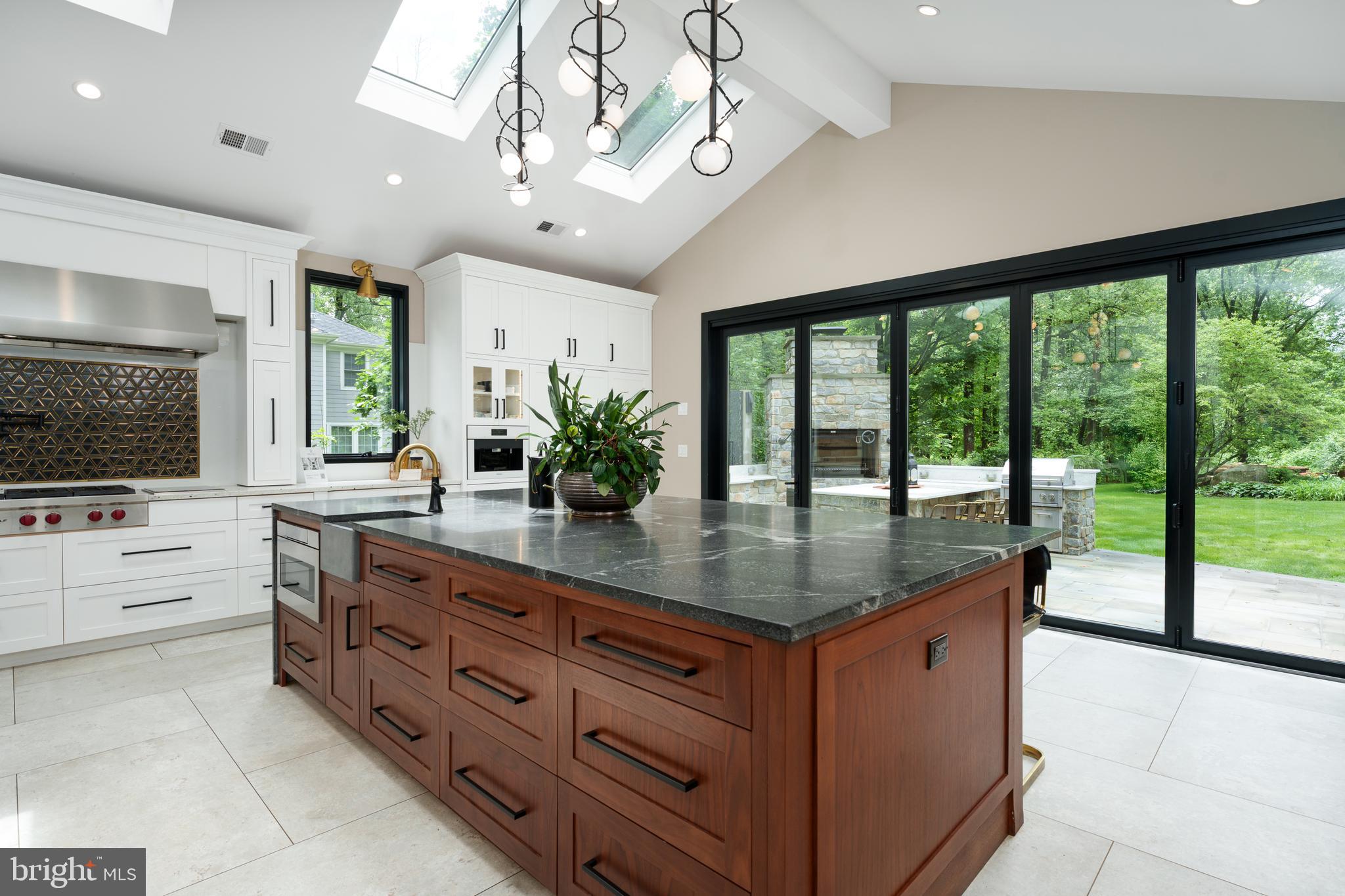 374 Cherry Hill Road Princeton, NJ 08540 - Photo 11 of 42 a dining hall with stainless steel appliances granite countertop a stove and a view of living room