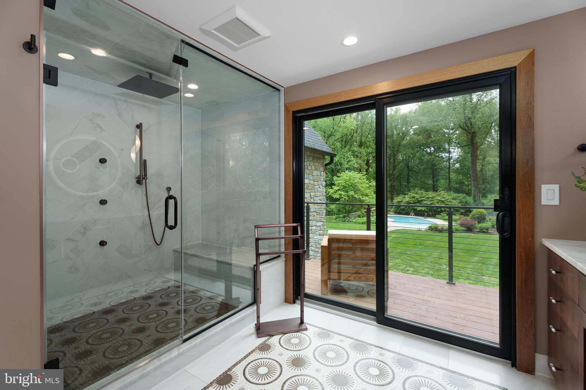 374 Cherry Hill Road Princeton, NJ 08540 - Photo 22 of 42 a bathroom with a glass shower door